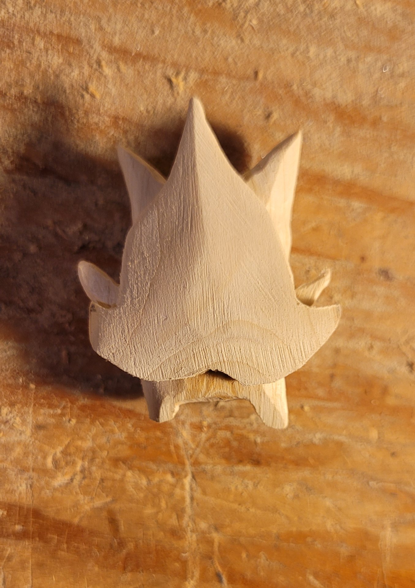 the tiny korok wearing his roughcut mask, which has been shaped down a bit