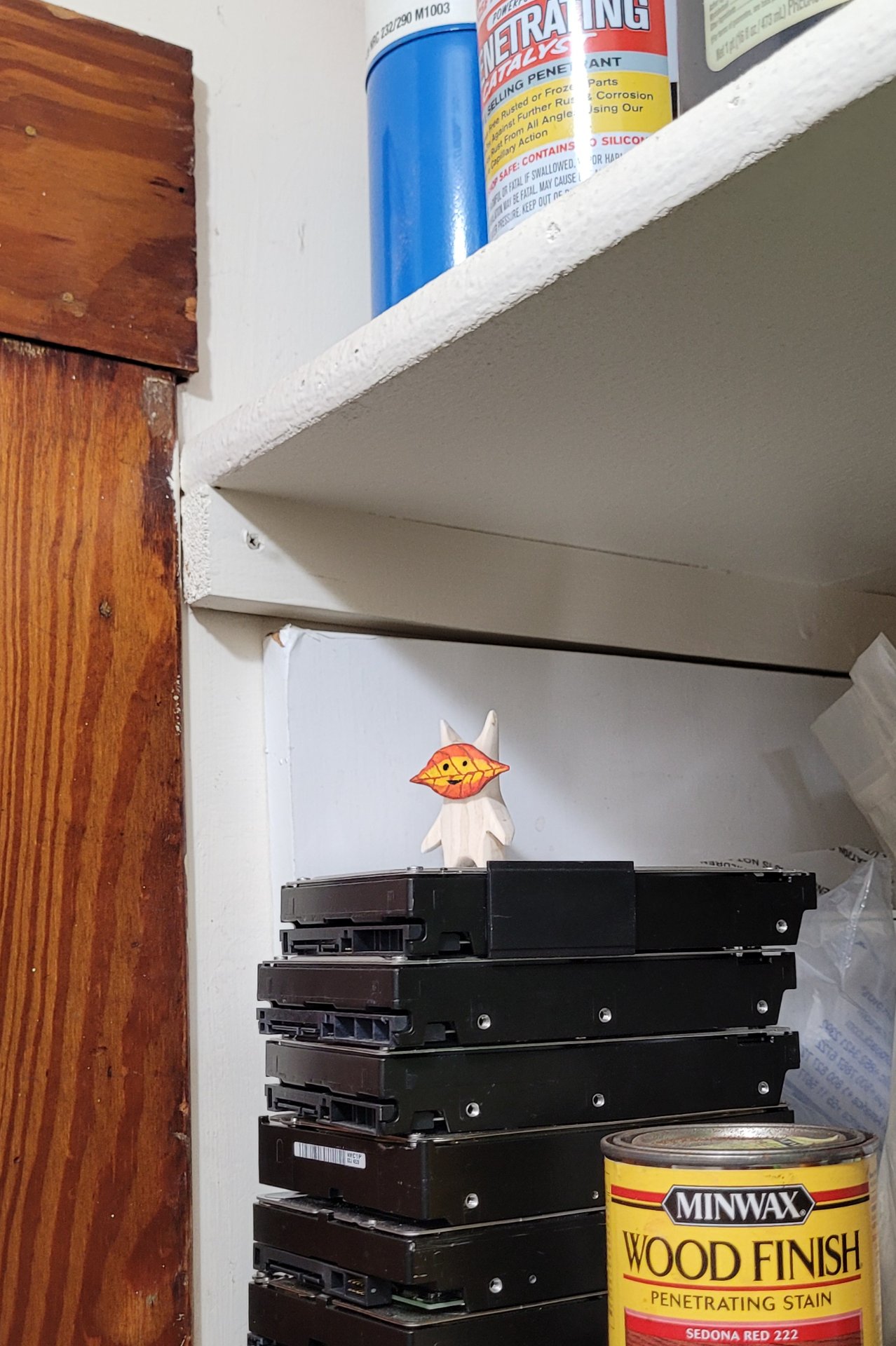 the finished korok hiding on top of a pile of hard drives on a shelf